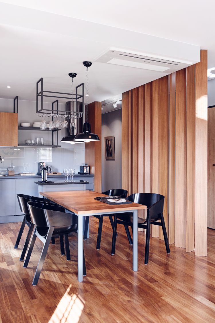 Modern dining space with sleek black Merano chair