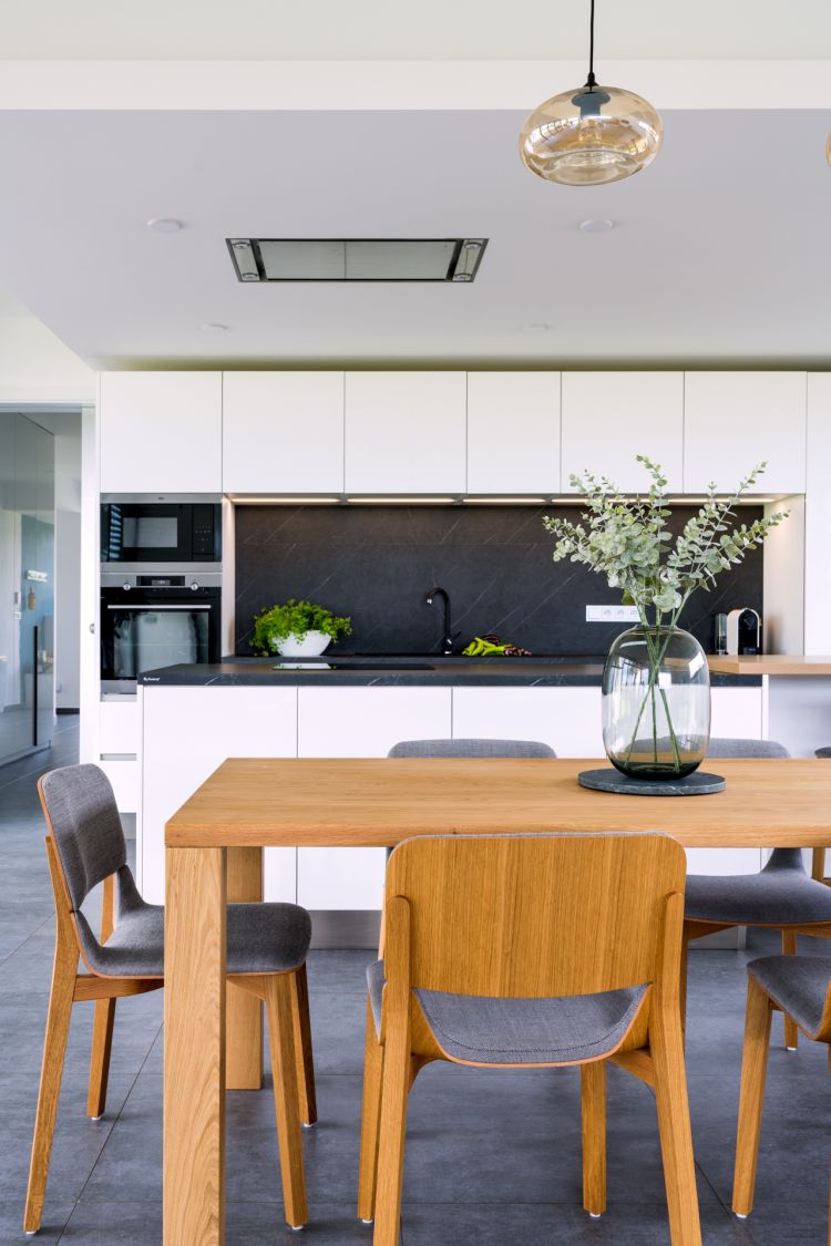 Modern kitchen interior with clean lines and stylish, natural furniture