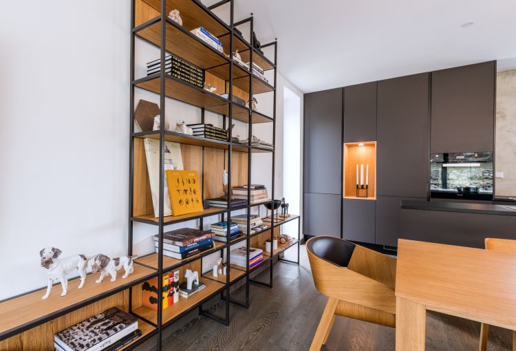 A contemporary, stylish house with a modern kitchen and chic Merano chair and armchair