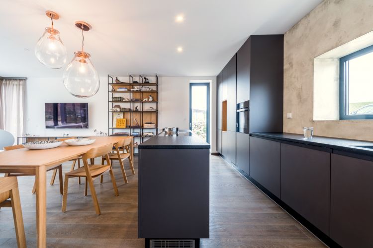 Interior view of a fashionable house with a modern kitchen and Merano chair and armchair