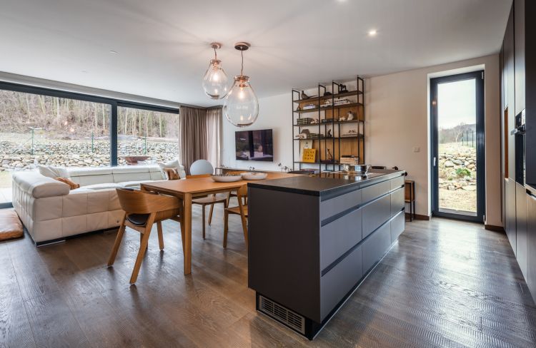 Modern kitchen in a stylish home with the Merano chair and armchair as chic accents