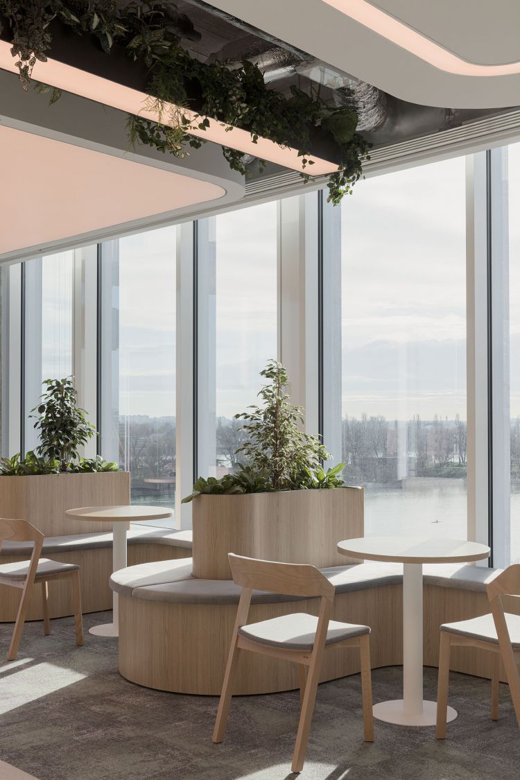 Modern office break area with large windows showcasing a city view