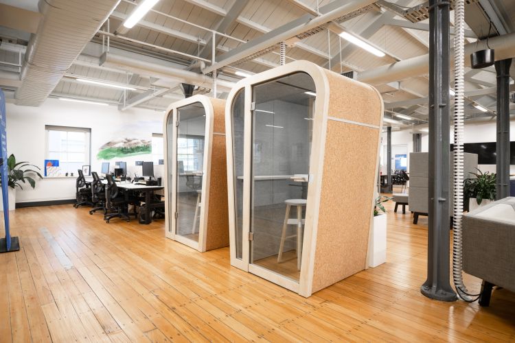 An open office with big meeting booths