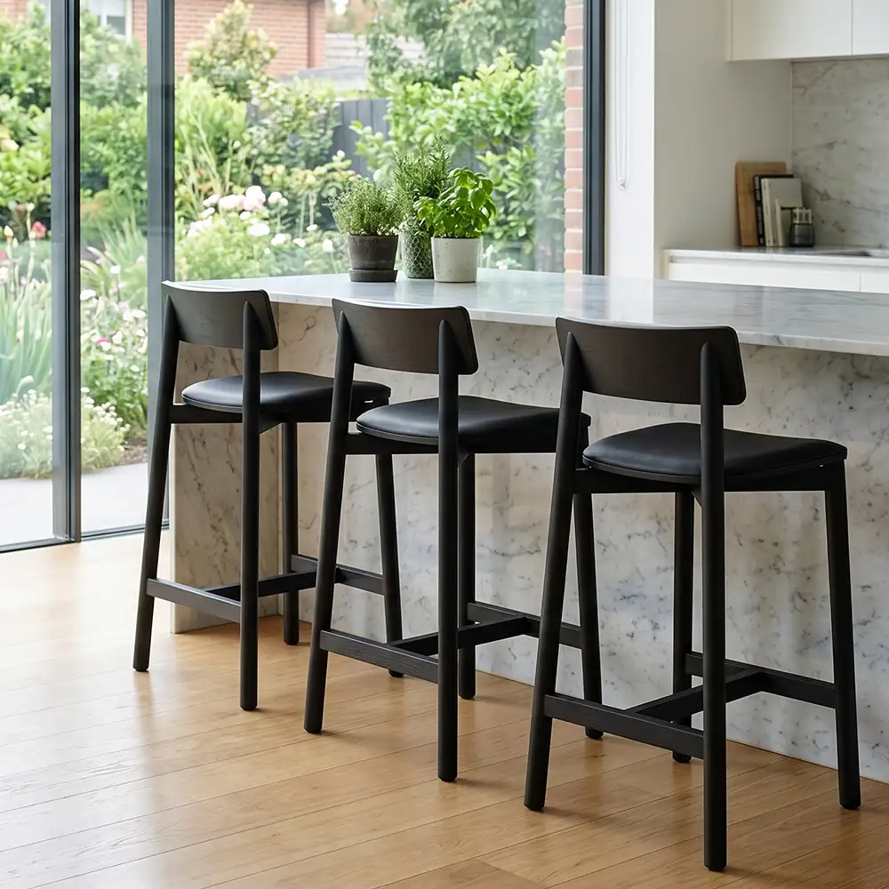 Upholstered Black Kitchen Stool at Bench in Modern Home