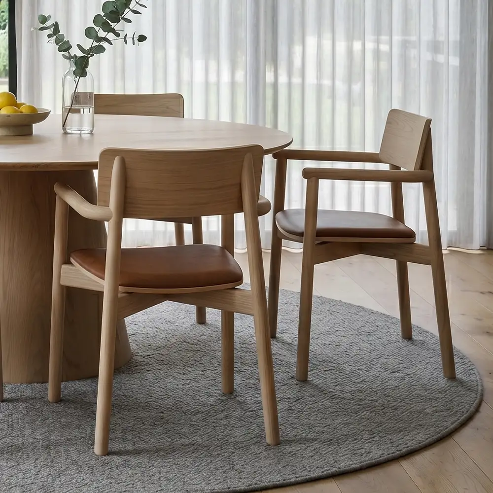 Tan leather Andi armchairs in a home