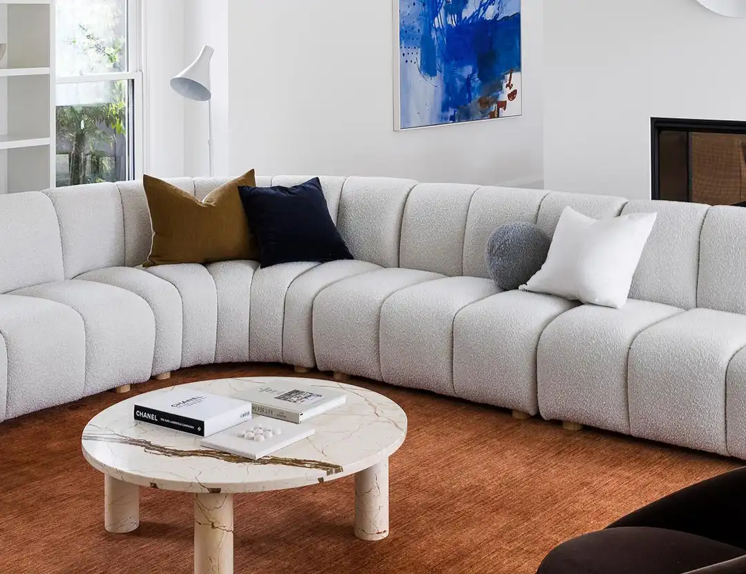 Diva Fringed Wool Rug in Ochre orange brown with grey modular sofa