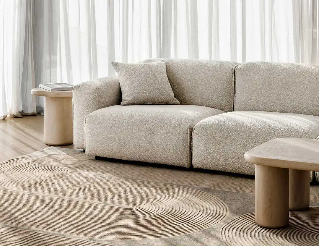 Viper Wool Patterned Rug in Snow beige geometric swirls with a beige sofa