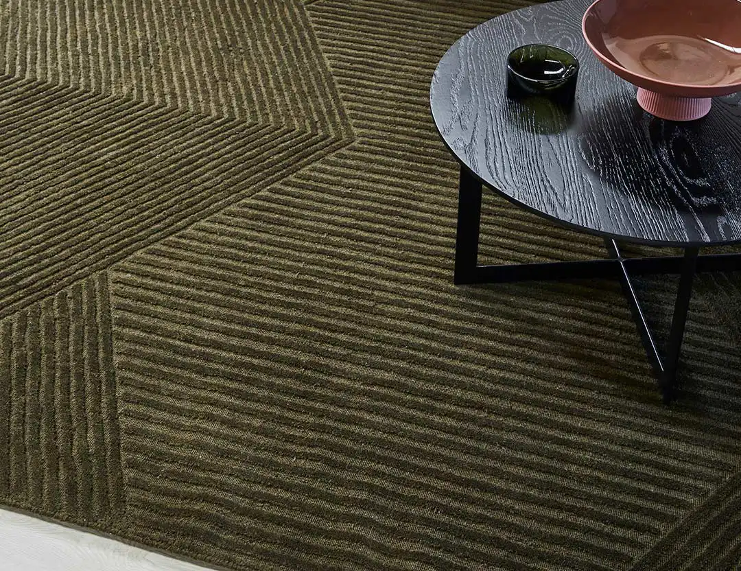 Abstract Elm Wool Rug in Olive green with black coffee table