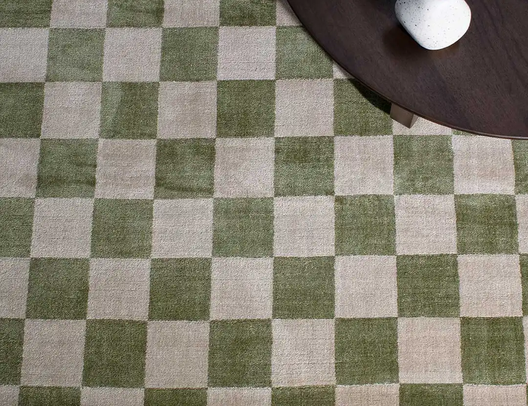 Calcada UV resistant Rug. Green & beige check rug with dark brown coffee table